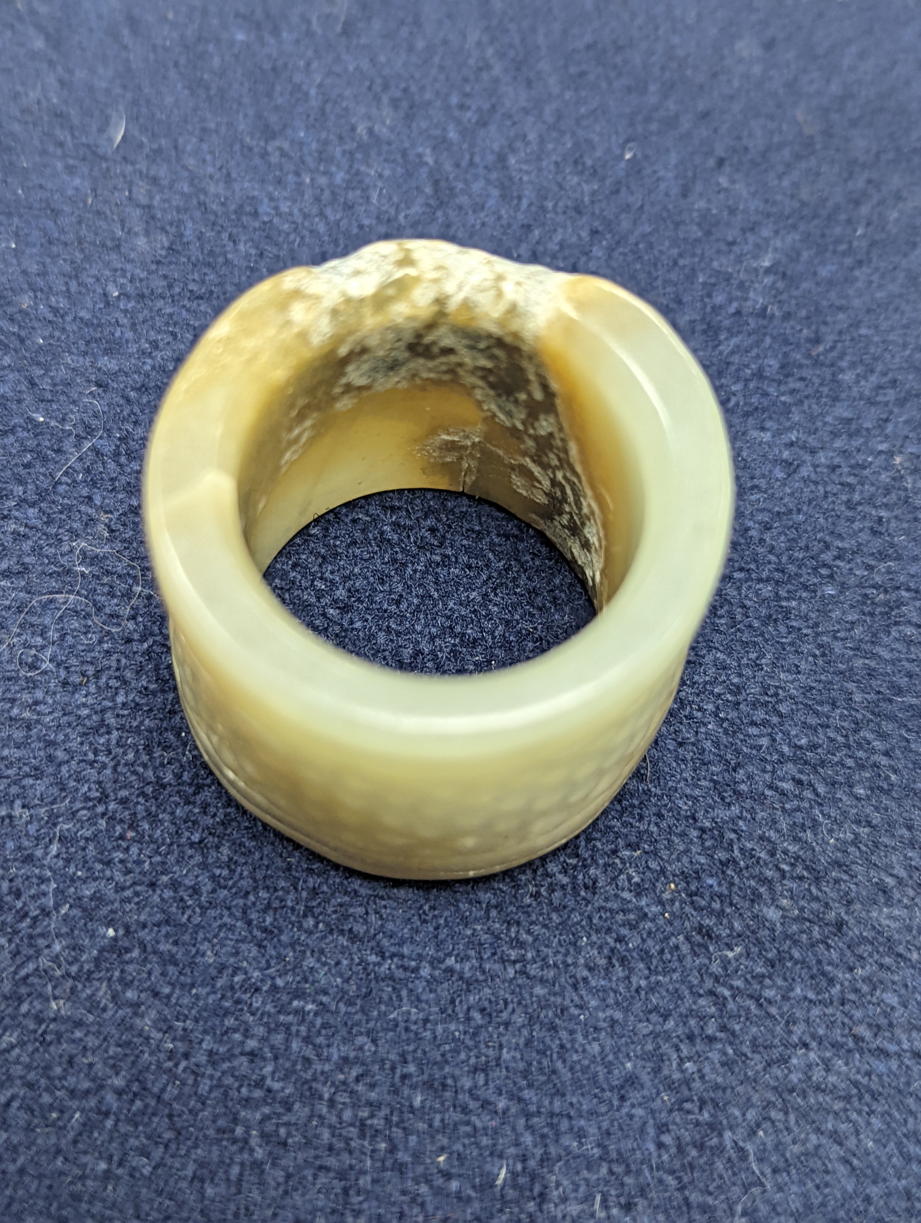 A Chinese jade belt hook, 12.5cm an archer's ring and figure, a stone cup and a glass snuff bottle
